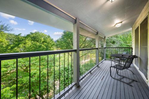 a screened in porch with a table on it at Carr's Northside Hotel and Cottages in Gatlinburg