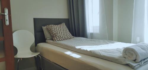 Llit o llits en una habitació de Apartamenty Po Kominiarzach lll
