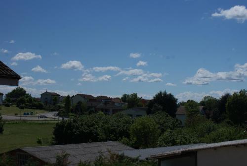 a view of a neighborhood with houses and trees at B&B La Rugiada in Tigliole