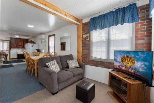 a living room with a couch and a flat screen tv at 113 E 24Th Ave, 1St Floor in North Wildwood