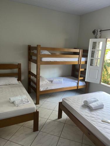 Postel nebo postele na pokoji v ubytování Casa Dona Amélia