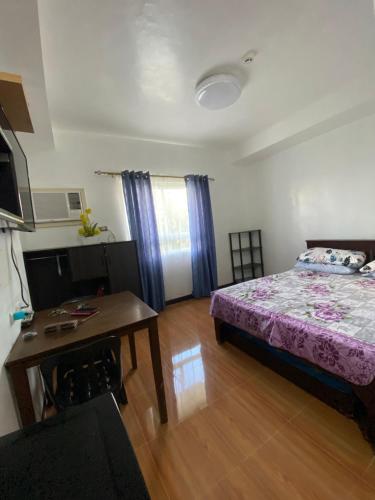 Cama o camas de una habitación en Mesaverte Residences AFS Suites