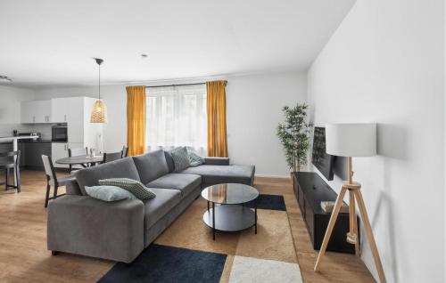 a living room with a couch and a table at Awesome Apartment In Lörrach With Wifi in Lörrach