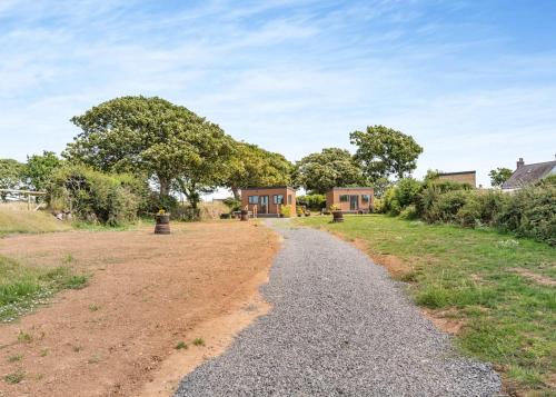a gravel road leading to a house at Calvesland Hideaway in Manorbier