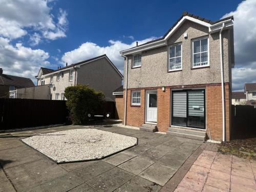 a brick house with a driveway in front of it at No 6, Ayr, 140m2, New Decor 2024, 3bedroom, detached house, with private gardens in Ayr