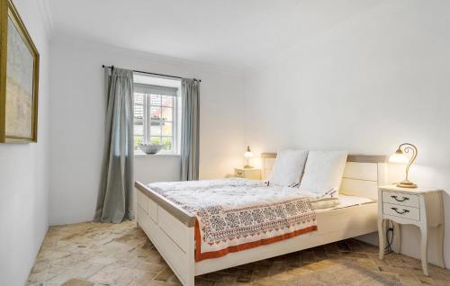 a white bedroom with a bed and a window at Gorgeous Home In Haderslev With Wifi in Haderslev