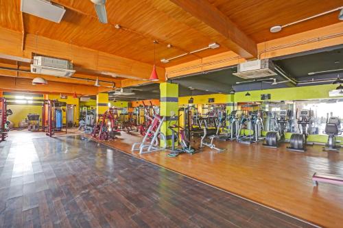 a gym with a lot of exercise equipment in a room at Collection O 80785 Hotel Shree Shyam in Rewāri