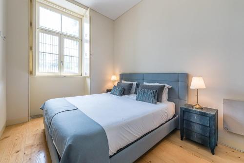 En eller flere senge i et værelse på GuestReady - La Maison Aires Gouveia