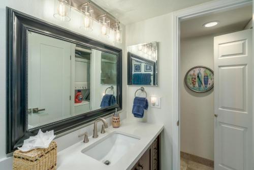 a bathroom with a sink and a mirror at Kamaole Sands 7-100 in Wailea