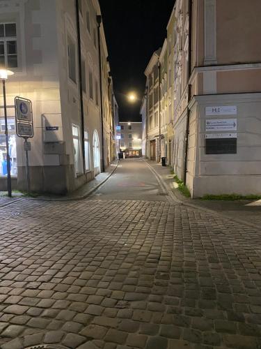 an empty street in a city at night at Penthouse - Zentral und Genial in Passau