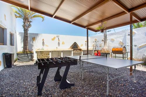 a ping pong table in the middle of a room at Las Palmeras in Güimar