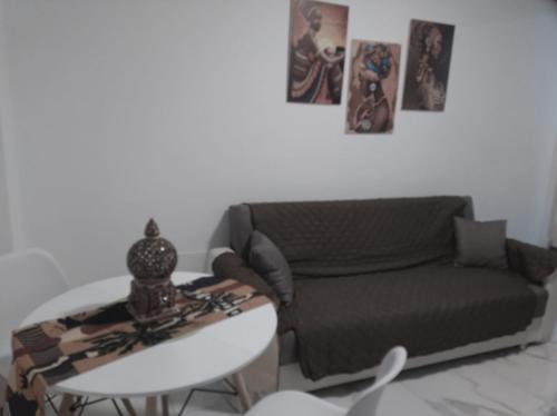 a living room with a couch and a table at RELUX ROMAGNA in Fiumana