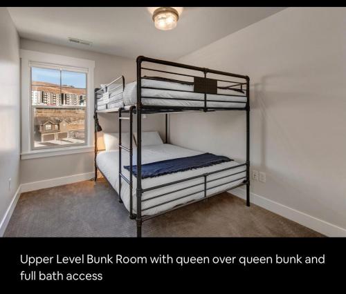 a bedroom with two bunk beds and a window at Wasatch Springs 13804 by Moose Management in Park City