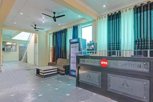 a living room with a video game console and a television at Super Hotel O New A V Hospitality in Lucknow