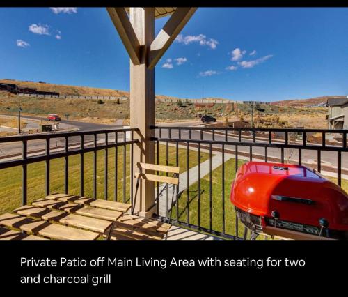 a red car is parked on a porch at Wasatch Springs 13804 by Moose Management in Park City