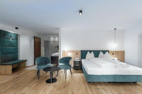 Postel nebo postele na pokoji v ubytování Hotel Alpenrose