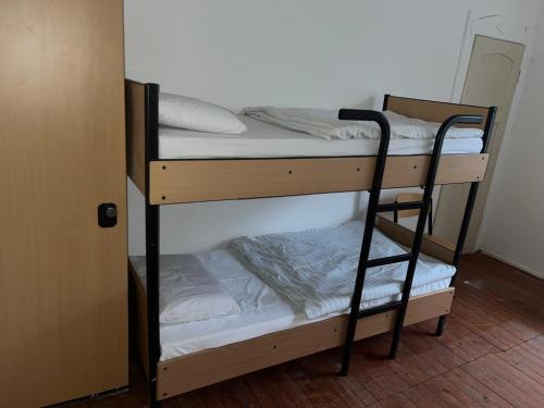 a couple of bunk beds in a room at Waldschlösschen Ricklingen in Hannover