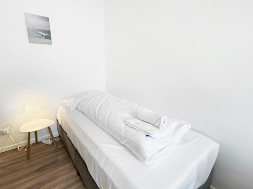 Ένα ή περισσότερα κρεβάτια σε δωμάτιο στο feworld living - Deutsch Wagram bei Wien