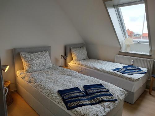 Postelja oz. postelje v sobi nastanitve Penthouse i Banken Bjerringbro
