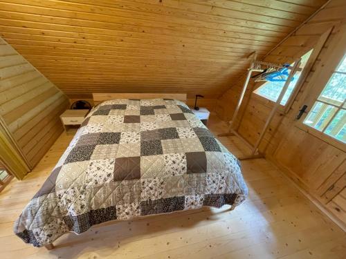 a bedroom with a bed in a attic at Garten Eden in Frohburg