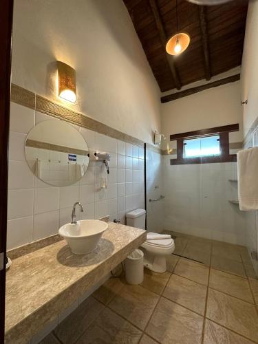 a bathroom with a sink and a toilet at Tayayá Aqua Resort in Ribeirão Claro