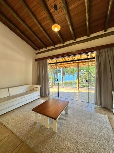 a living room with a couch and a table at Tayayá Aqua Resort in Ribeirão Claro