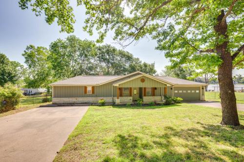 a house with a tree in front of it at Private Dock and Fire Pit Cedar Creek Reservoir Gem in Gun Barrel City