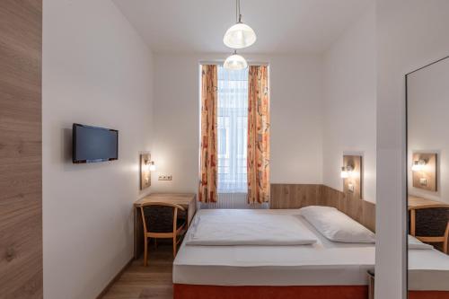 Ein Bett oder Betten in einem Zimmer der Unterkunft Hotel Terminus