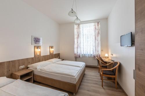 Ein Bett oder Betten in einem Zimmer der Unterkunft Hotel Terminus