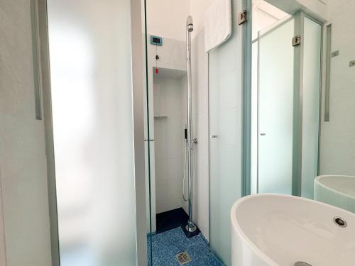 a bathroom with a tub and a sink and a shower at Vingt Sept in Polignano a Mare