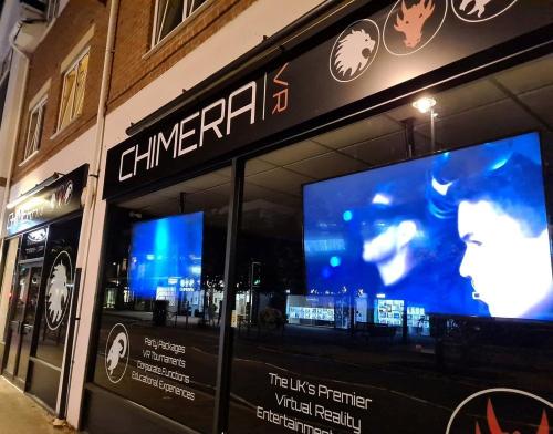 a store front with a large screen in front of it at Skyline at Fleet Heights Apartment Six in Fleet