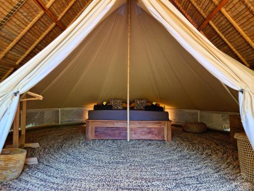 Un ou plusieurs lits dans un hébergement de l'établissement Miavaka Lodge