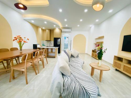 a living room with a couch laying on the floor at Holiday Villa Novaworld Phan Thiet in Phan Thiet