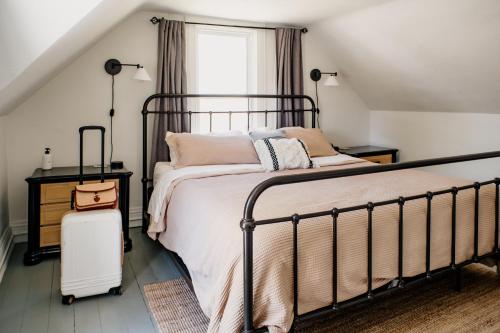 a bedroom with a large bed and a window at The Paige By Tanglewood Getaways in Pepin