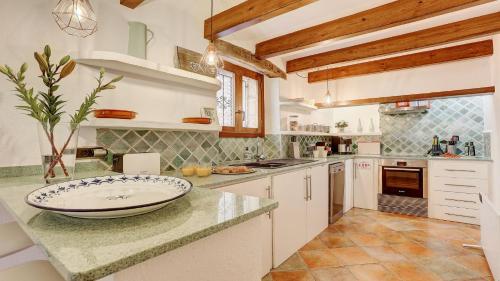 a kitchen with a large bowl on a counter at Can Williams in Pollença