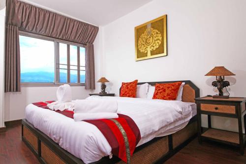 מיטה או מיטות בחדר ב-Jade Tower