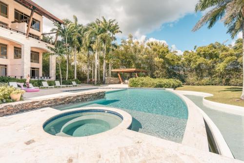 a swimming pool in the middle of a yard at Wonderful Apt at Casa de Campo in El Infiernito