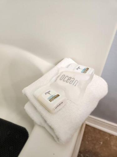 a pile of towels sitting on top of a sink at Condo in Gulf Shores King Suite in Gulf Shores