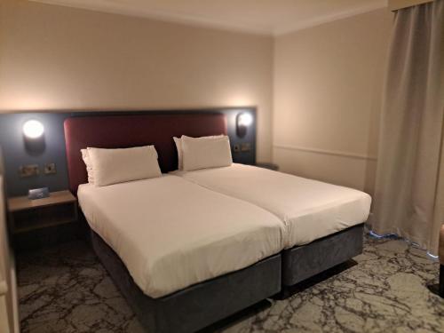 Säng eller sängar i ett rum på London Croydon Aerodrome Hotel, BW Signature Collection