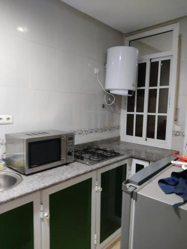 Kuchyň nebo kuchyňský kout v ubytování Papito