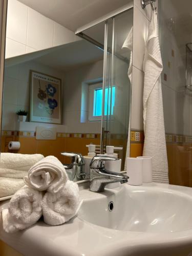 a bathroom with a sink with towels on it at Kuća Šuma in Velika Buna