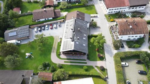 an overhead view of a building with a yard at Pension Wagnerhof in Oberaudorf