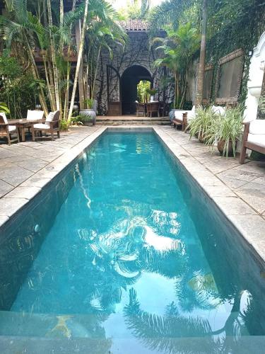 a swimming pool with a fish in the water at Monkey Casa Hotel in Trancoso