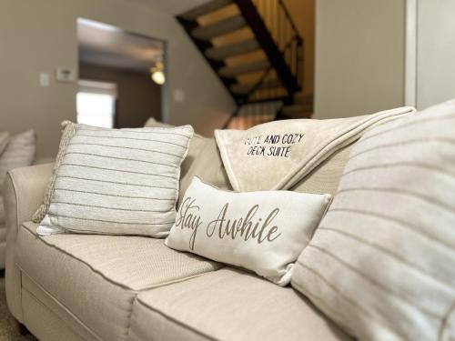 a white couch with pillows on top of it at CUTE AND COZY DECK SUITE in Pittsburgh