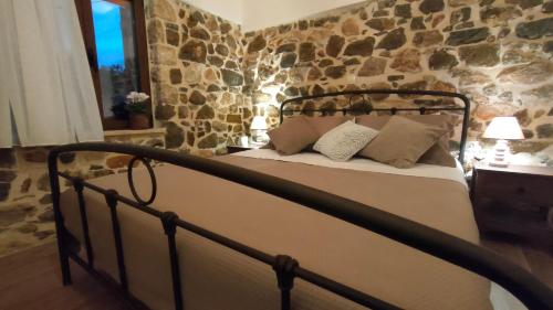 Ένα ή περισσότερα κρεβάτια σε δωμάτιο στο Nafplio Village