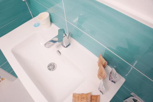 a bathroom with a sink and a bath tub at B&B Vesuvius Central in Torre del Greco