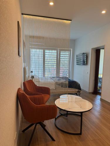 Posezení v ubytování Apartamentai pas Rasą