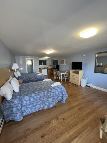 Ένα ή περισσότερα κρεβάτια σε δωμάτιο στο Beau Rivage Motel