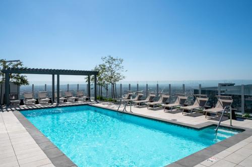 a swimming pool on top of a building at Level Los Angeles - Downtown Flower in Los Angeles