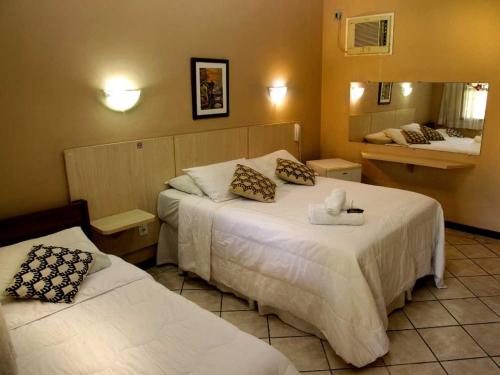 מיטה או מיטות בחדר ב-Vila Francesa Hotel